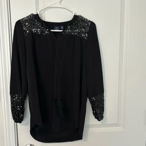 Black dress top with glitter embellishment